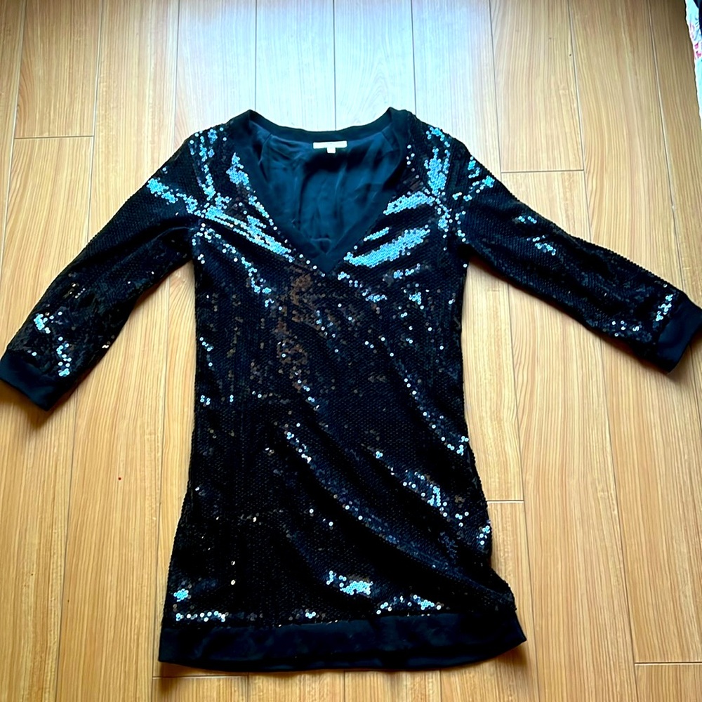 Black sequin cocktail dress with pockets